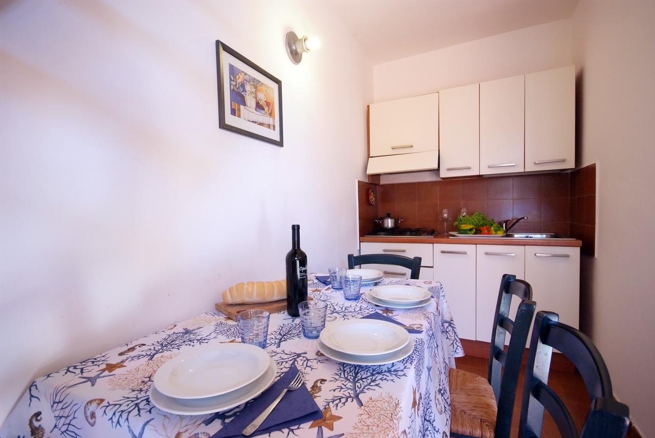 Residence Sud Est Porto Azzurro Bagian luar foto